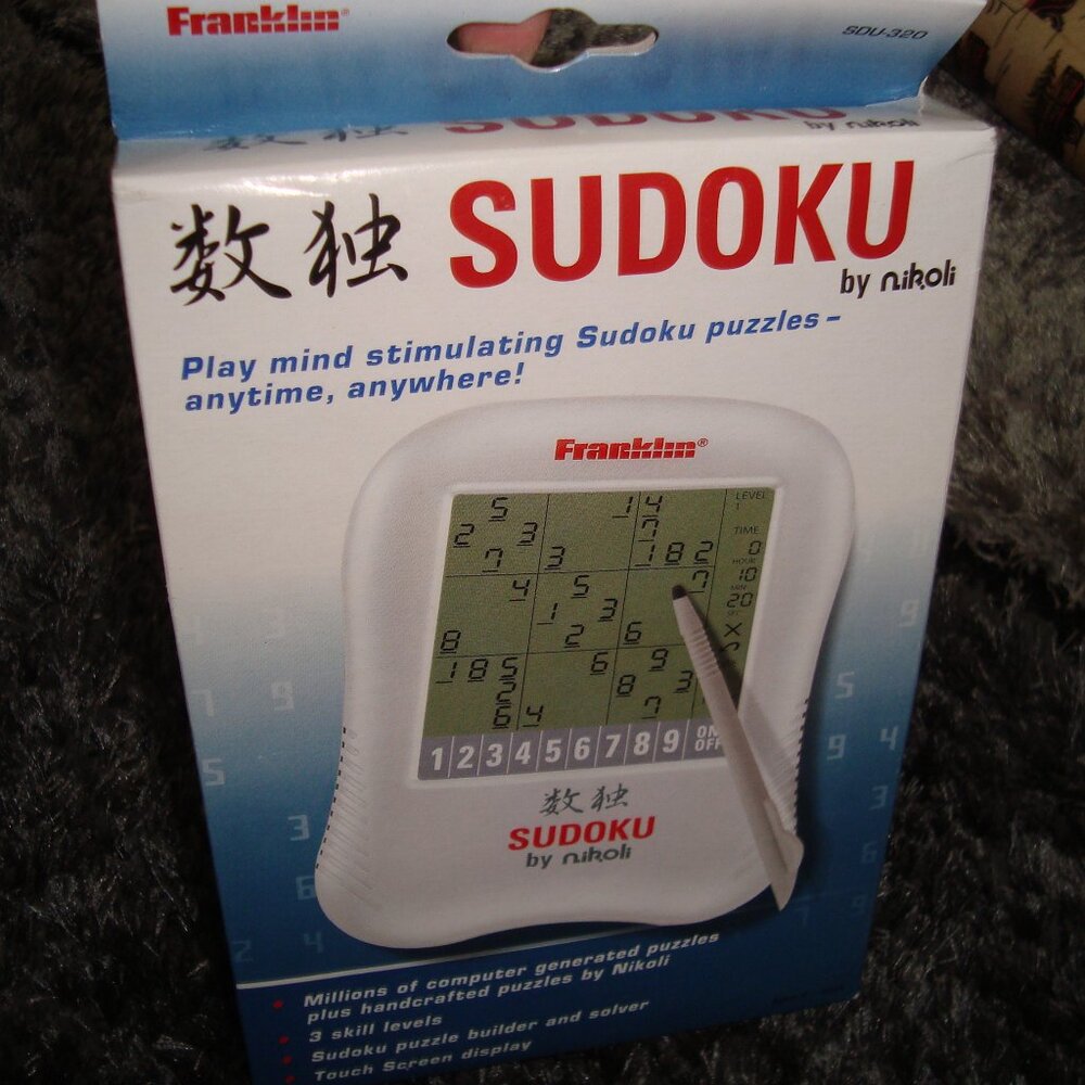 Sudoku Handheld Game with Touch Screen Display by Nikoli New Sealed